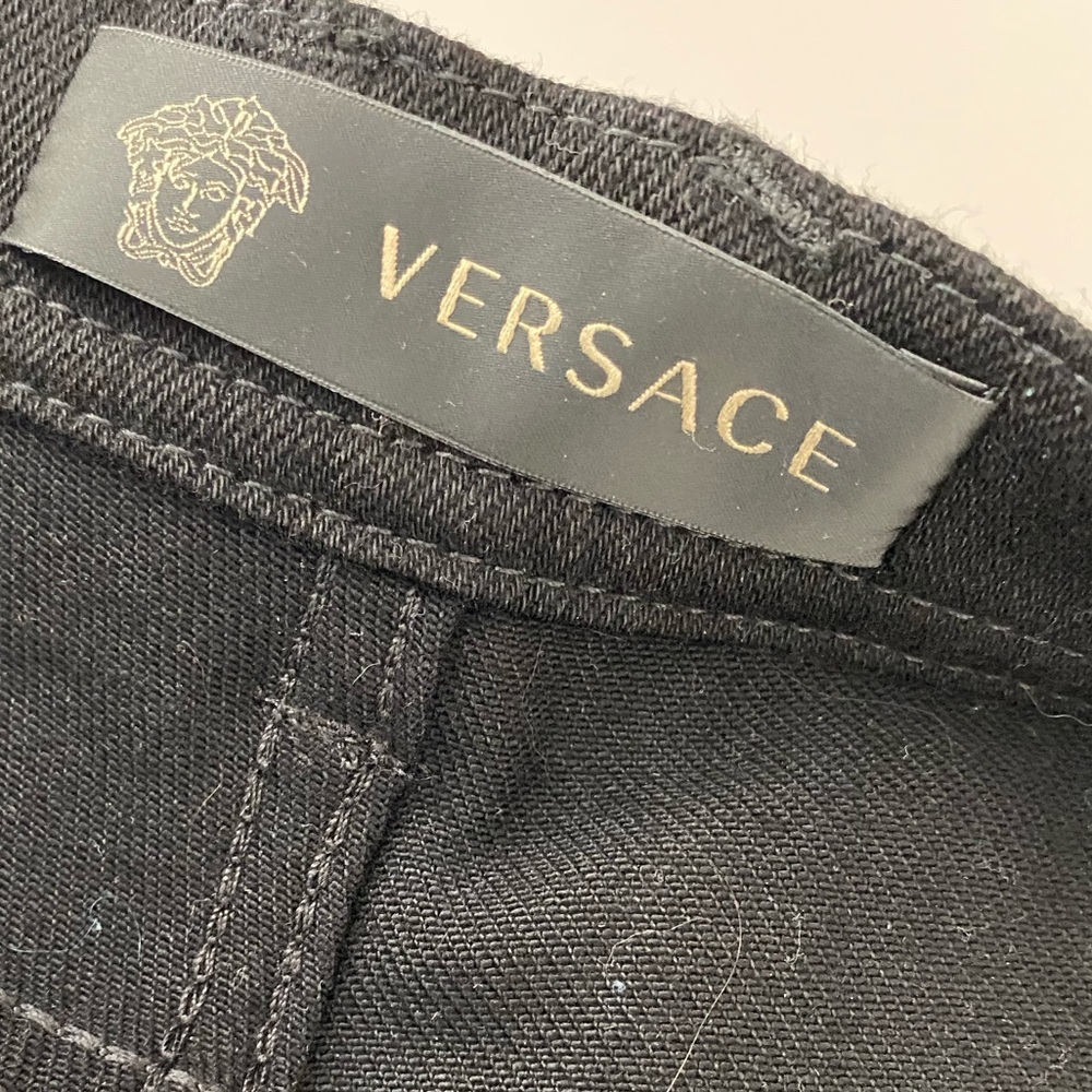 Versace Black Denim with cutout design down leg